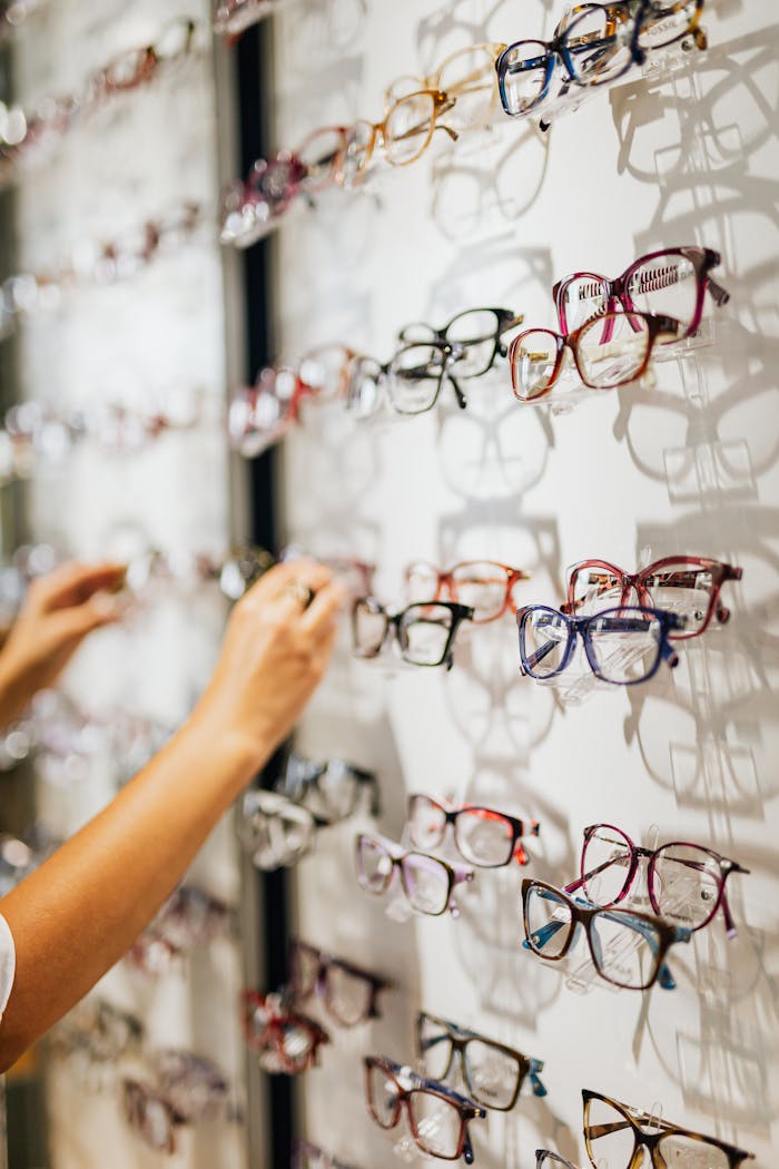 A vibrant selection of eyeglasses in various styles on display at an optical store.